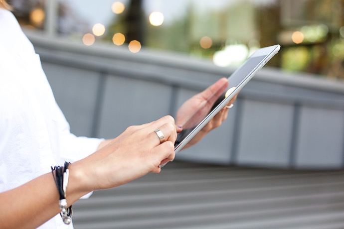 person holding iPad